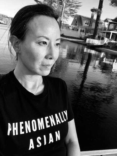 Headshot t of Ramona Piretti, Public Educator of English Literature in West Hartford, CT.  Wearing T-shirt that reads, Phenomenally Asian.