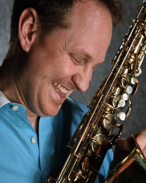 Headshot, closeup informal Scott M. Graves in profile with Tenor Saxophone in hand