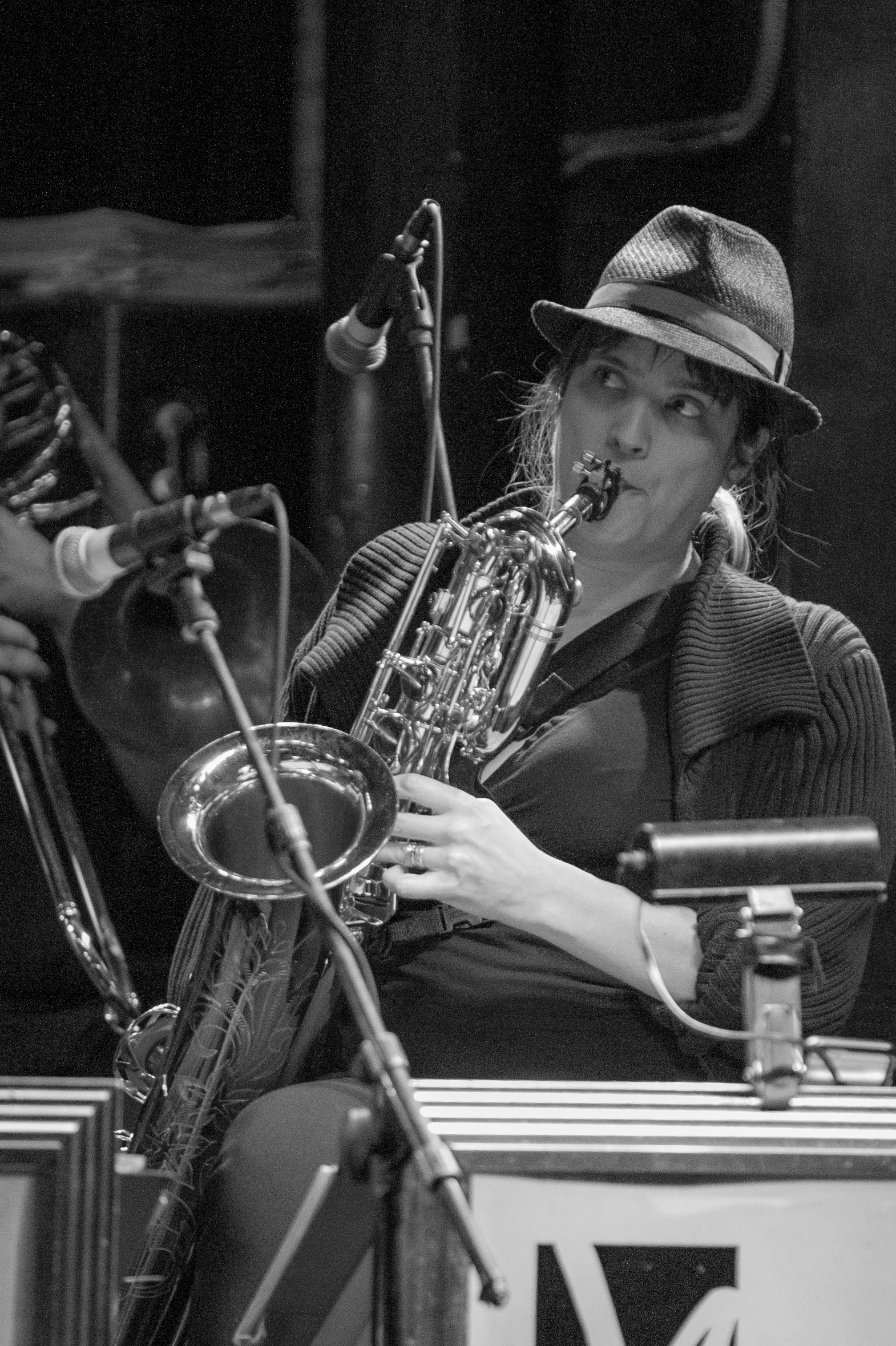 Performance picture in black and white of baritone saxophonist Melanie Howell Brooks