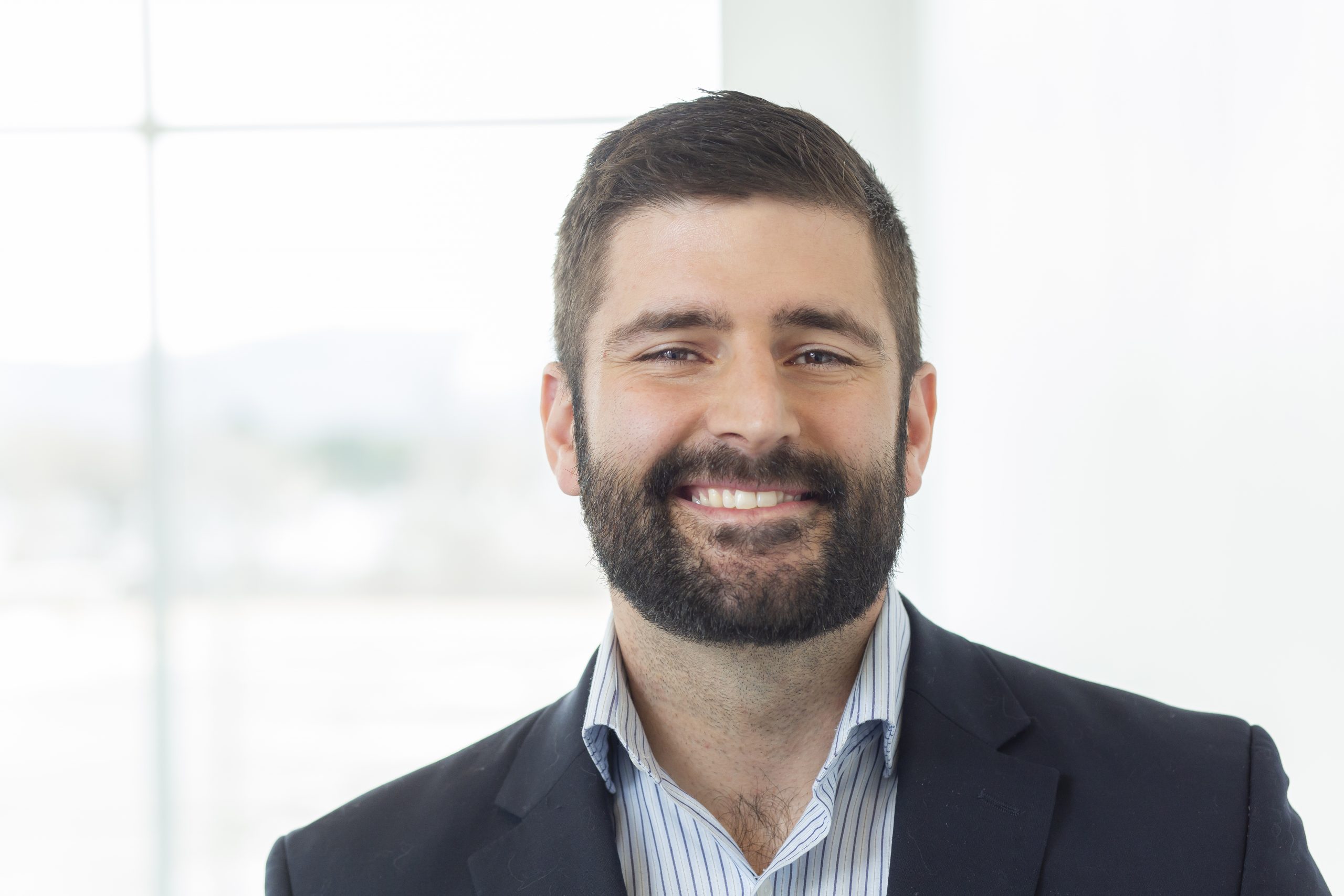 Full color headshot of entrepreneur and research scientist Justin McKennon