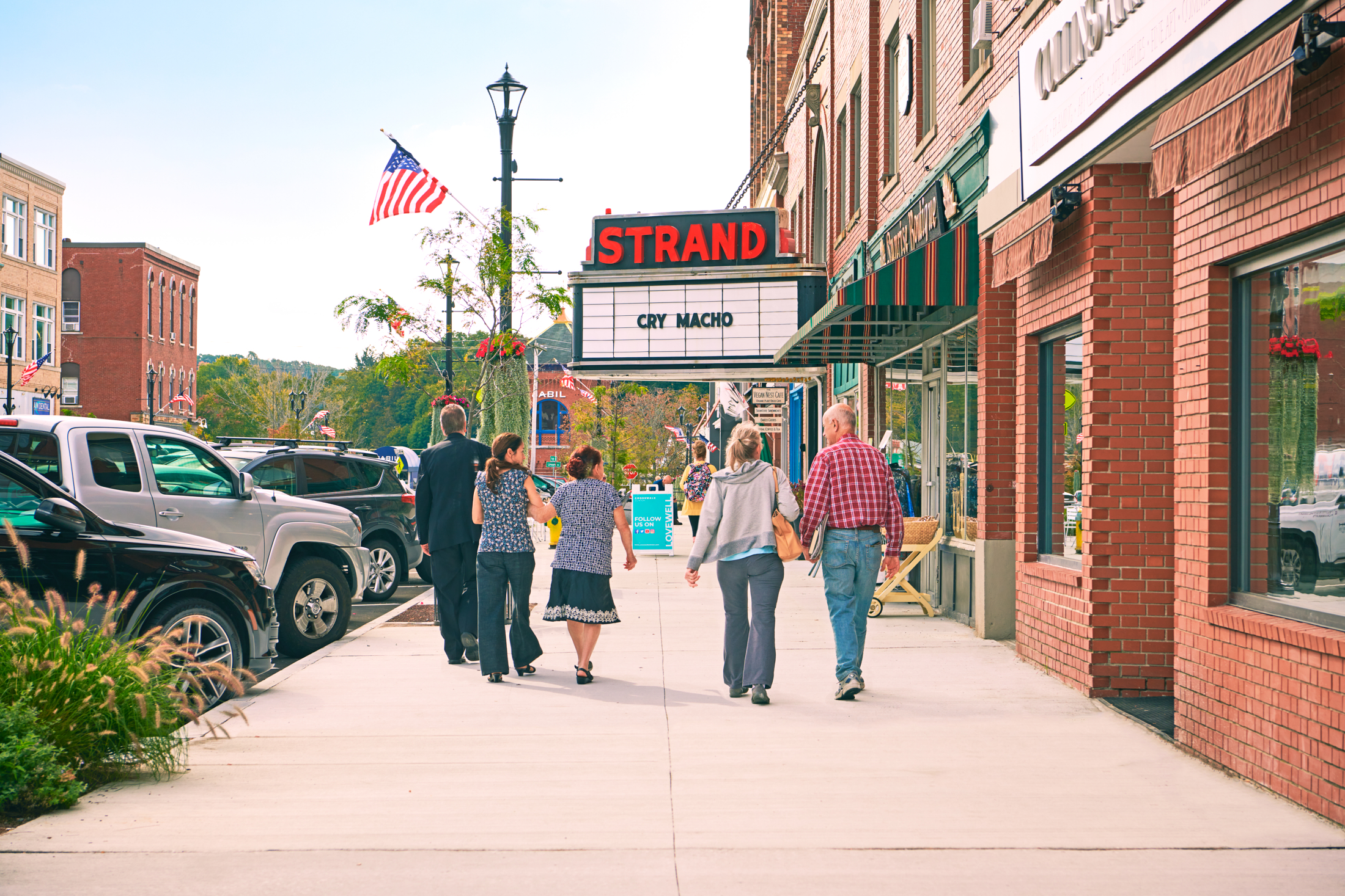 Sidewalk level view of Strand Theatre, in full color, Clinton, MA