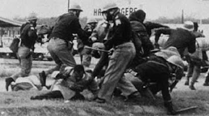Black and White Photo of SNCC John Lewis being beaten by Alabama Law Enforcement on the Edmund Pettus Bridge, Selma Alabama during the Civil Rights Movement