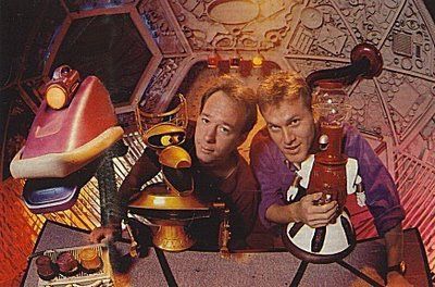 Full Color Image of Joel and Mike, the Hosts of the famed 1990's Science Fiction B Movie Slug-fest known as Mystery Science Theatre 3000