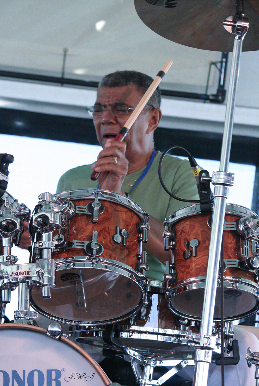 A behind the kit image of Jack DeJohnette playing at the Newport Jazz Festival in 2012