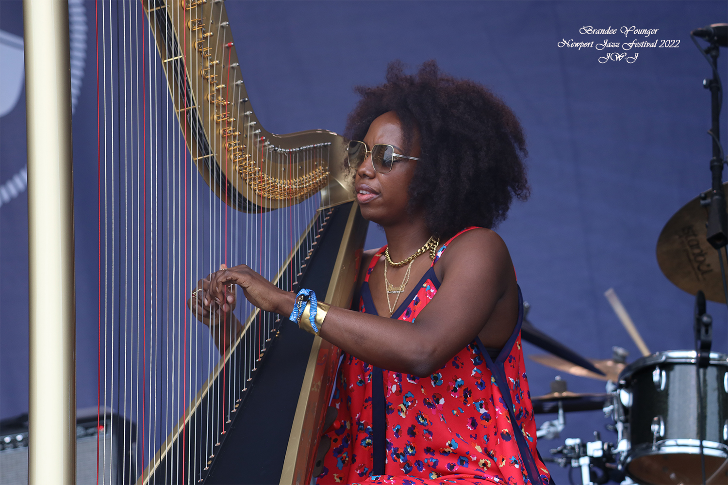 Full color shot of Brandee Younger on stage at the 2022 Newport Jazz Festival in Rhode Island