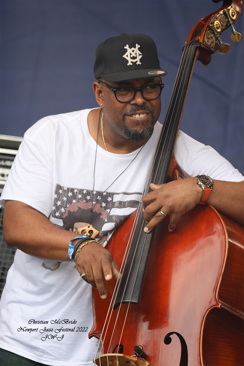 Full color shot of Christian Mc Bride on stage at the 2022 Newport Jazz Festival in Rhode Island