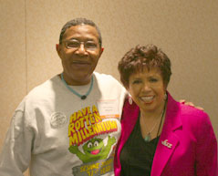 Bob Cranshaw Ful color interior photo of Poet and Spoken Word artist Jessica Care Moore sitting alongside your host, Joan Watson-Jones.