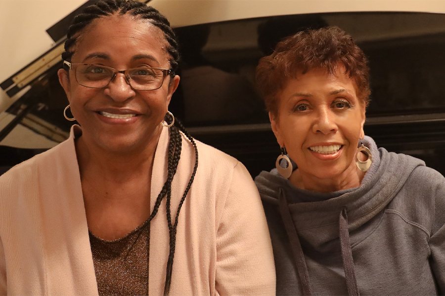 Ful color interior photo of Poet and Spoken Word artist Jessica Care Moore sitting alongside your host, Joan Watson-Jones. 